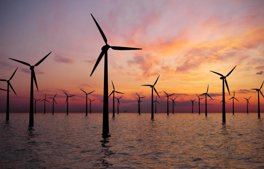 renewable energy wind turbines at sunset, aerial photograph
